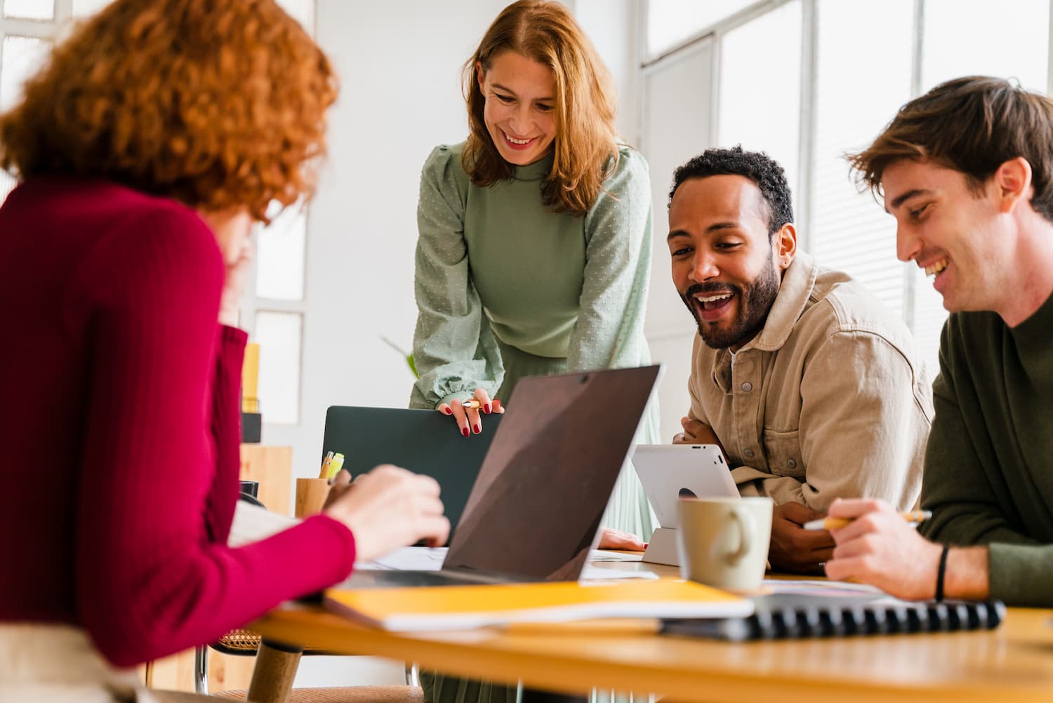 fairness in the workplace is depicted with employees enjoying working together at one of the Best Small Workplaces for 2023